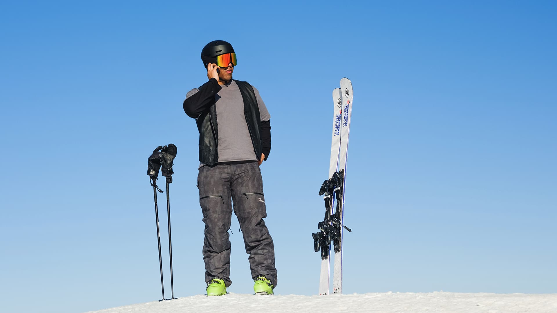 Skier Standing on Top of a Slope Banner Image